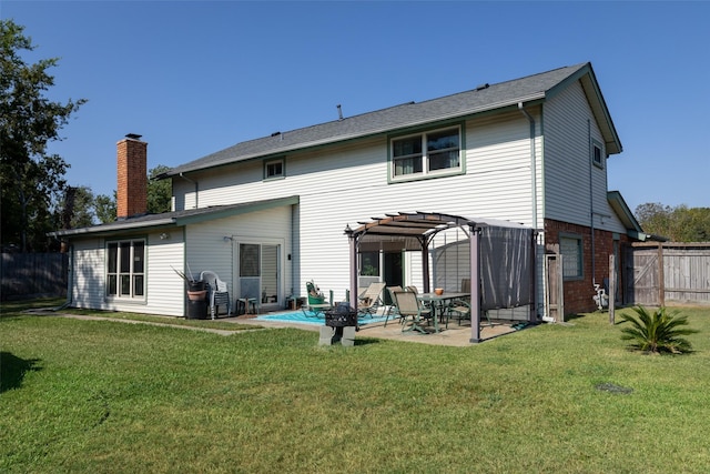 back of property featuring a pergola, a lawn, and a patio