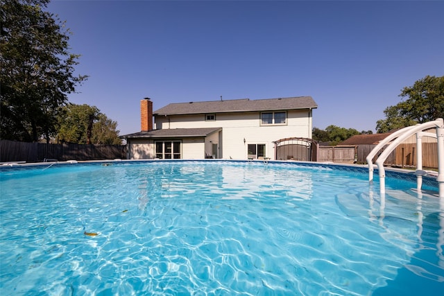 view of pool with a water slide