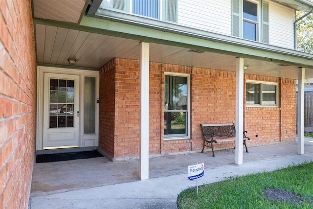 entrance to property with covered porch