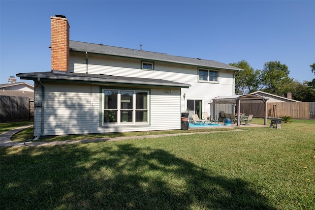 back of property with a patio, a gazebo, a lawn, and a pergola