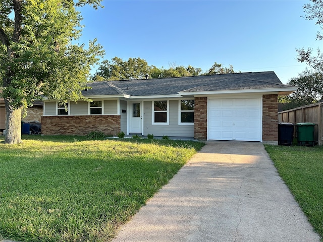 single story home with a front yard and a garage