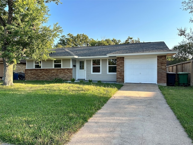 single story home with a front yard and a garage