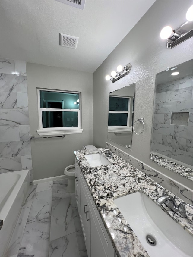 full bathroom with vanity, shower with separate bathtub, toilet, and a textured ceiling