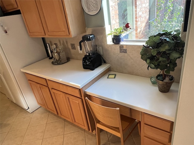 kitchen with white refrigerator and light tile patterned floors