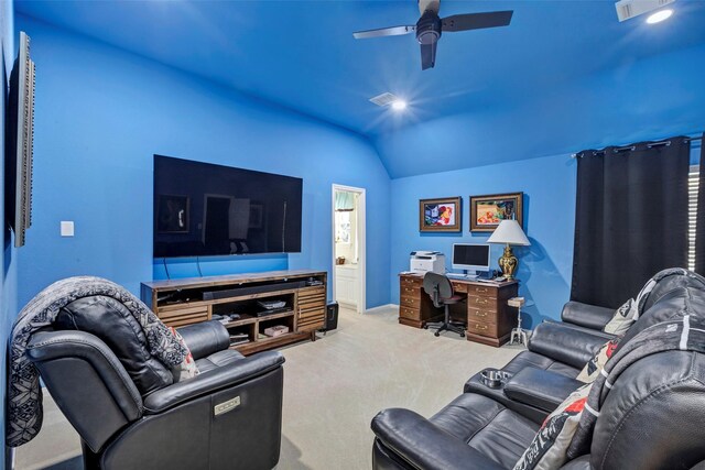 carpeted living room featuring ceiling fan and vaulted ceiling