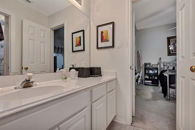 bathroom with tile patterned flooring and vanity