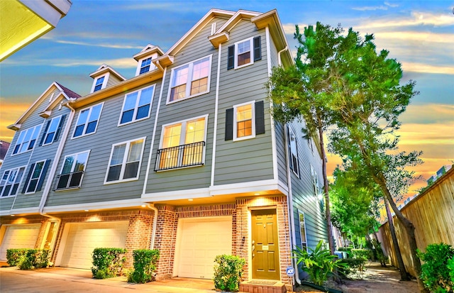 townhome / multi-family property featuring a garage