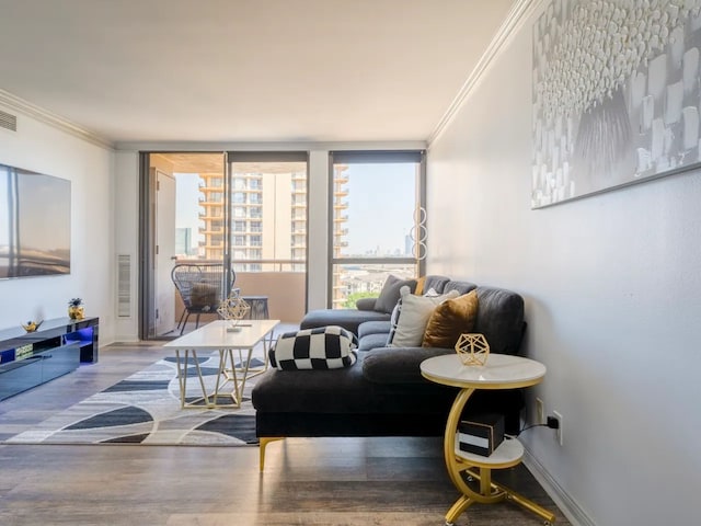 living room with expansive windows, crown molding, and hardwood / wood-style floors