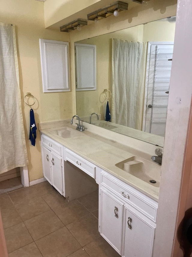 bathroom with vanity and tile patterned floors