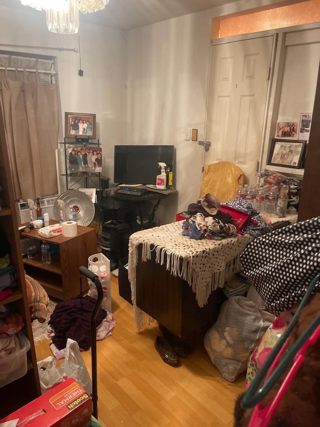 bedroom with a closet and hardwood / wood-style floors