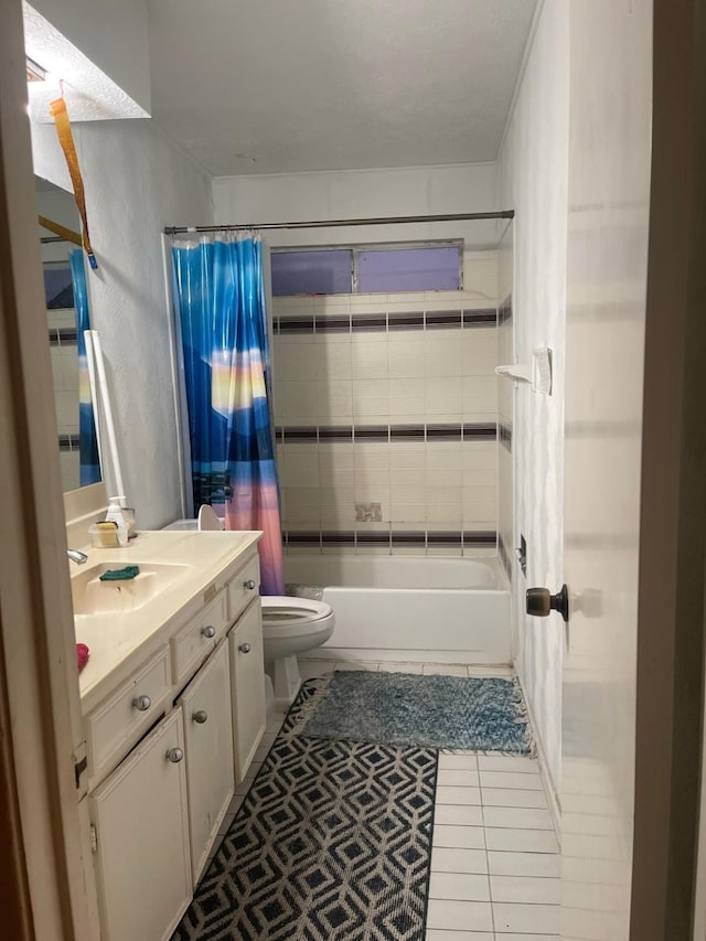 full bathroom featuring shower / bath combination with curtain, tile patterned flooring, vanity, and toilet