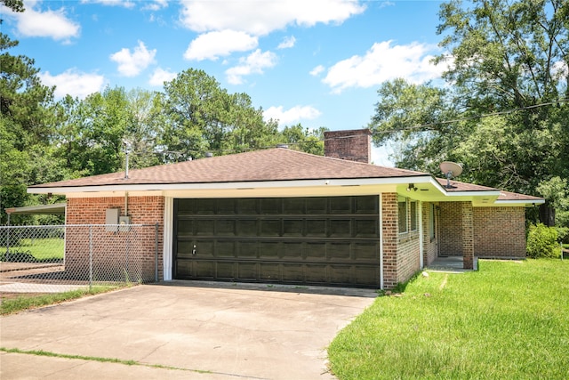 ranch-style house with a garage and a front yard