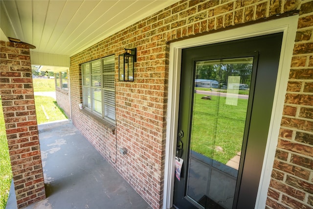 doorway to property with covered porch