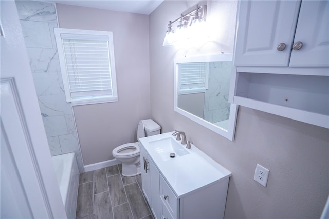 full bathroom with vanity, shower with separate bathtub, and toilet