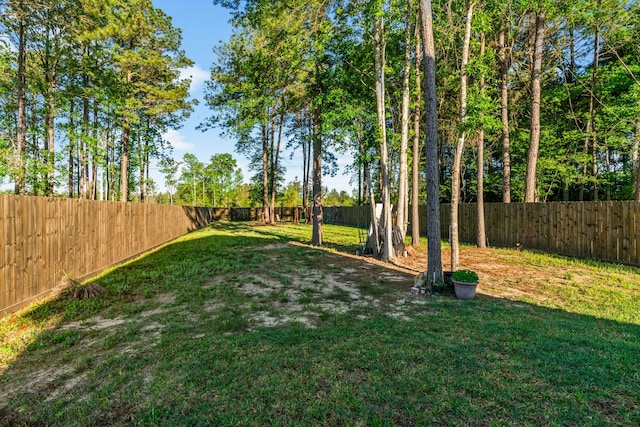 view of yard with a fenced backyard