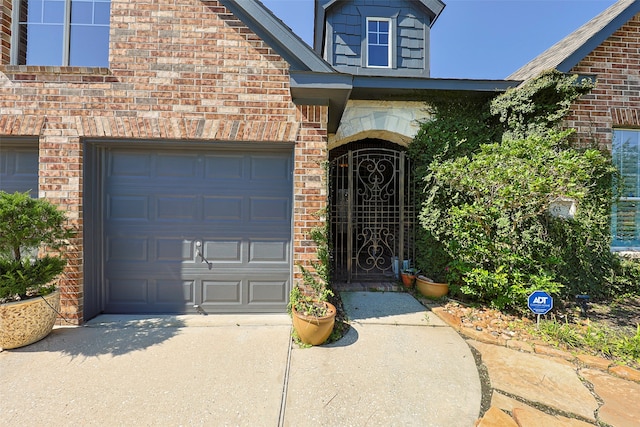 doorway to property featuring a garage