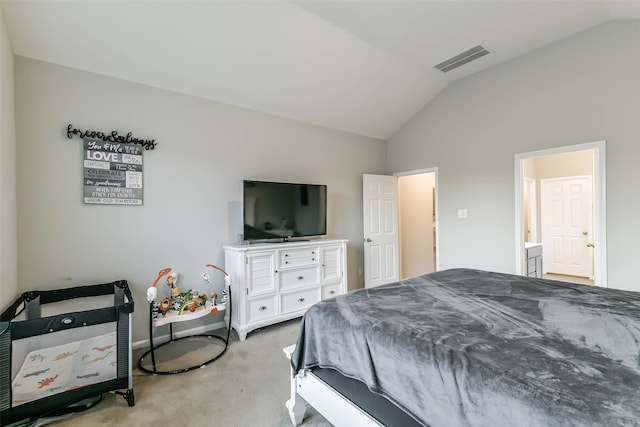 carpeted bedroom featuring lofted ceiling