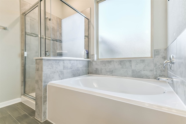 bathroom with plus walk in shower and hardwood / wood-style floors