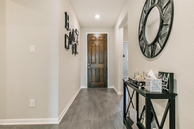 corridor with dark wood-type flooring