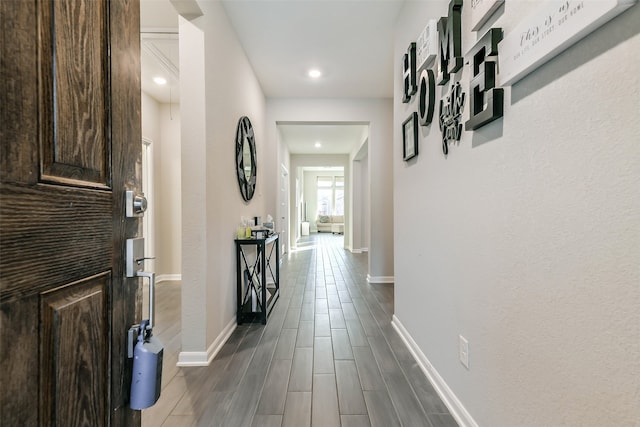 hallway featuring dark hardwood / wood-style flooring