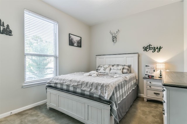 carpeted bedroom featuring multiple windows