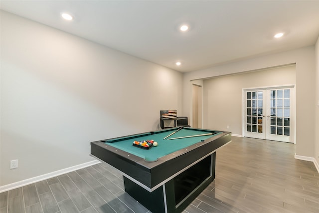 game room with french doors, hardwood / wood-style flooring, and pool table