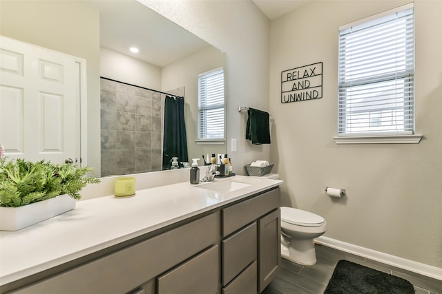 bathroom with toilet, hardwood / wood-style floors, vanity, and a shower with curtain