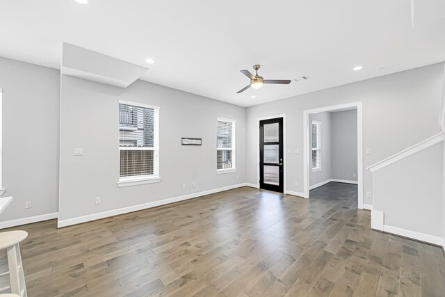 spare room with ceiling fan and dark hardwood / wood-style flooring