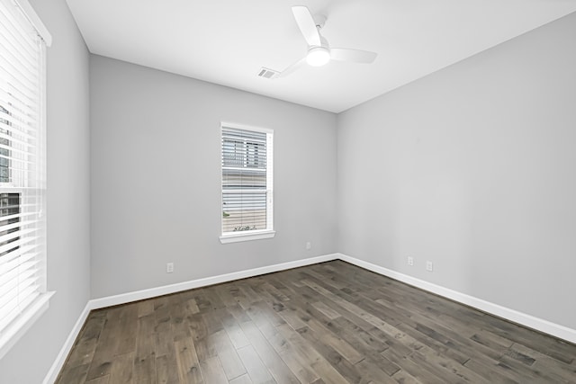 empty room featuring dark hardwood / wood-style floors and ceiling fan