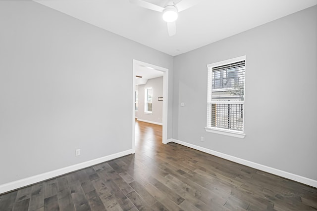 unfurnished room with ceiling fan and dark hardwood / wood-style flooring