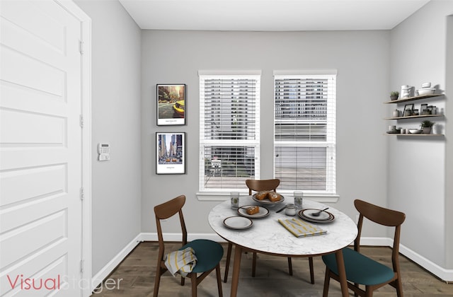 dining area with dark hardwood / wood-style flooring