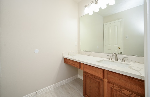 bathroom featuring wood-type flooring and vanity