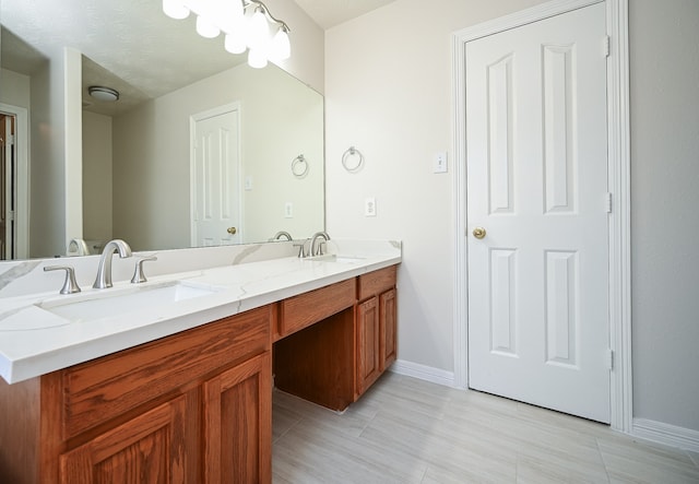 bathroom featuring vanity and a textured ceiling