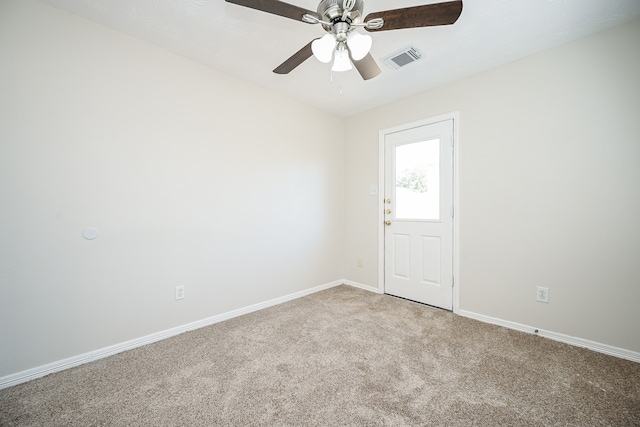 unfurnished room with carpet flooring and ceiling fan