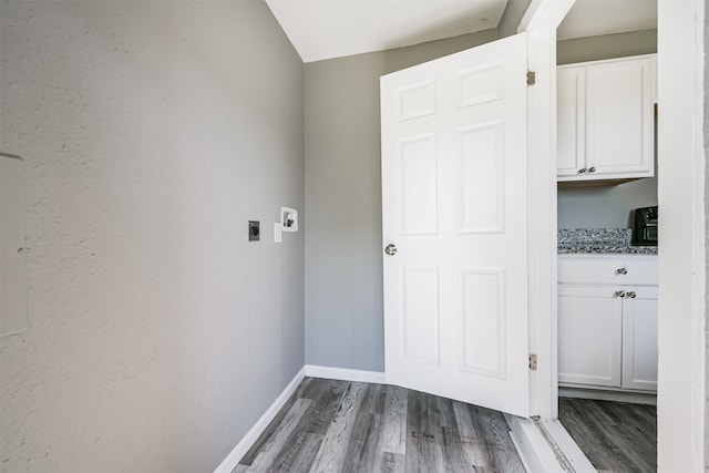 corridor featuring dark hardwood / wood-style flooring