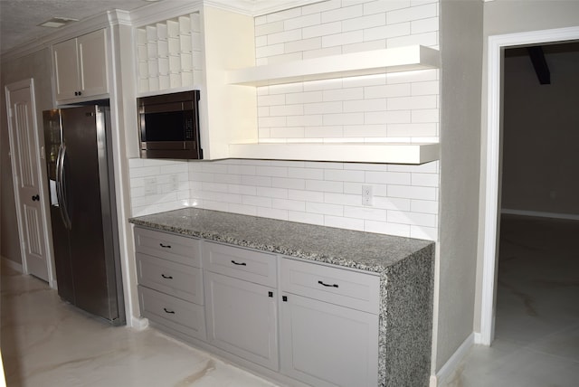 kitchen with decorative backsplash, stone counters, stainless steel appliances, ornamental molding, and white cabinets