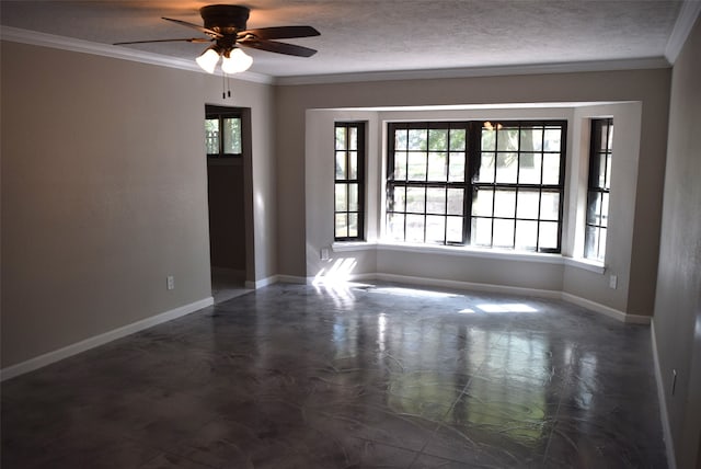 spare room featuring plenty of natural light, ornamental molding, and ceiling fan