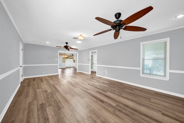 unfurnished living room with ornamental molding, hardwood / wood-style flooring, and ceiling fan