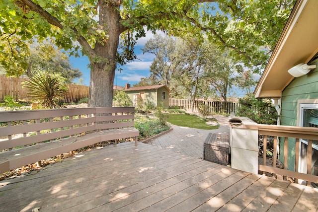 wooden deck with an outbuilding