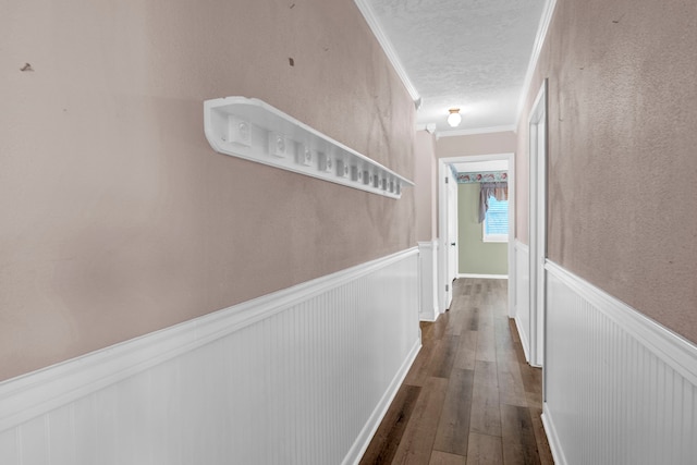 hallway featuring crown molding and dark hardwood / wood-style flooring