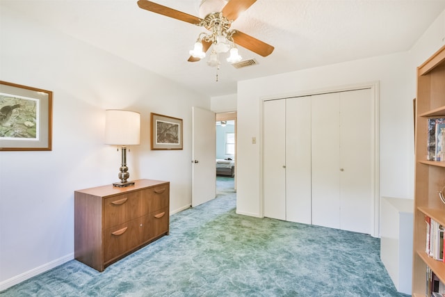 bedroom with ceiling fan, light carpet, visible vents, baseboards, and a closet