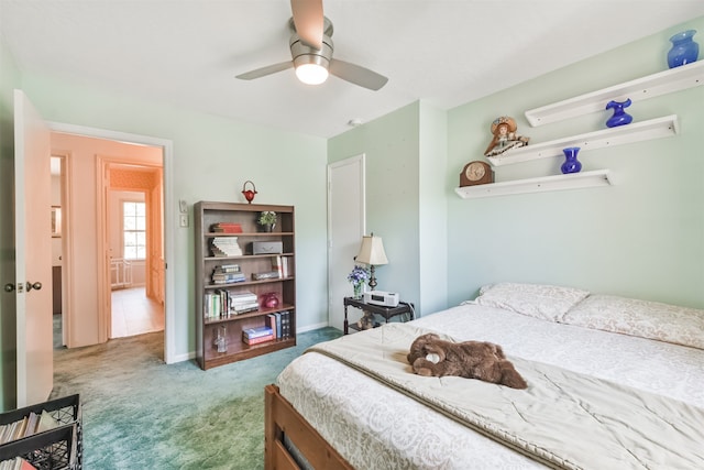 bedroom with ceiling fan and carpet floors