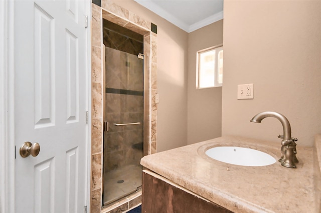 bathroom with a shower with door, ornamental molding, and vanity