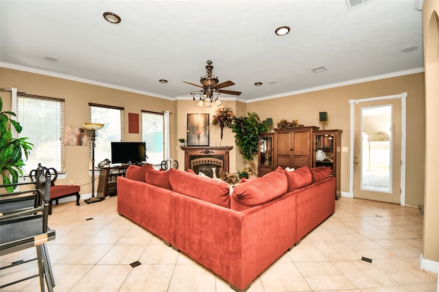 living room featuring crown molding, light tile patterned flooring, and ceiling fan