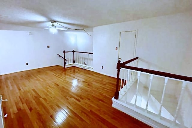 unfurnished room with ceiling fan and hardwood / wood-style floors