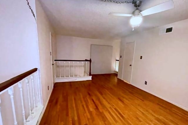 unfurnished room featuring hardwood / wood-style floors and ceiling fan