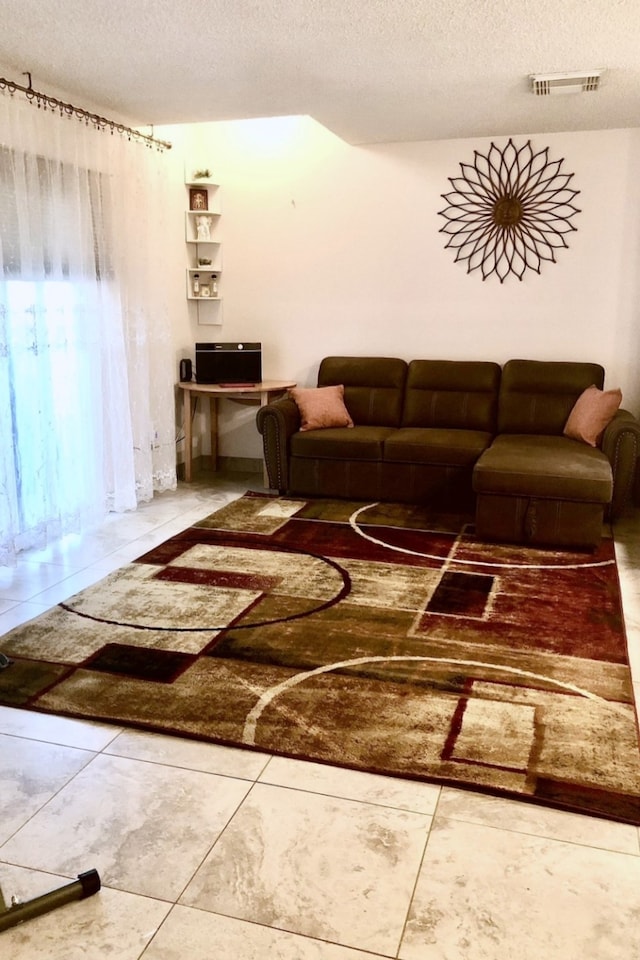 living room with a textured ceiling