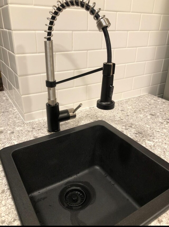 3600 Jeanetta St Unit 502, Houston, TX 77063 - kitchen view of a sink, light countertops, and tasteful backsplash