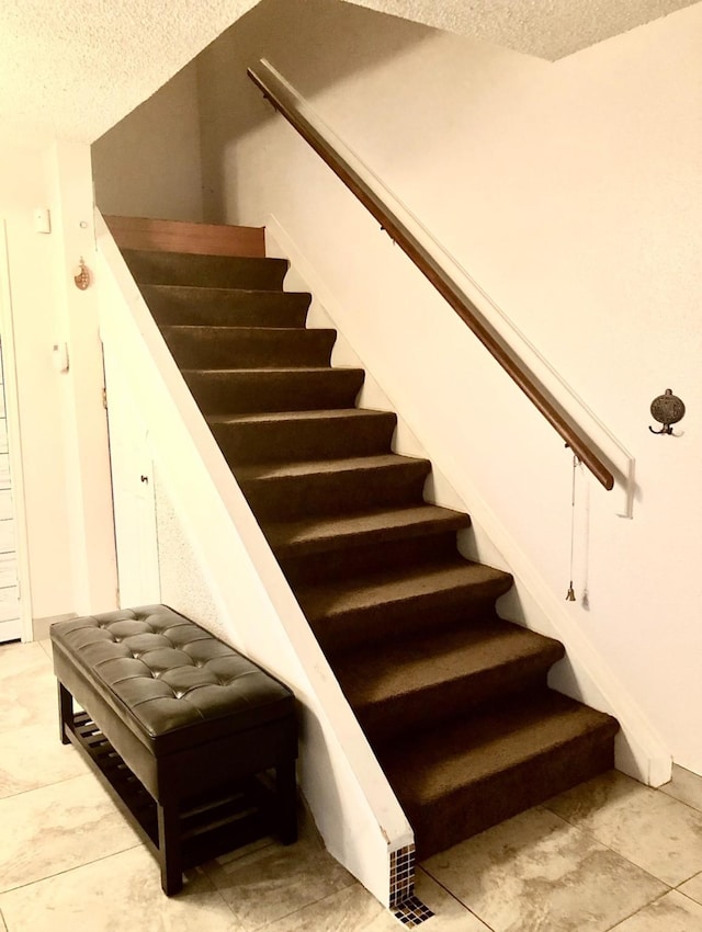 3600 Jeanetta St Unit 502, Houston, TX 77063 - stairs featuring a textured ceiling