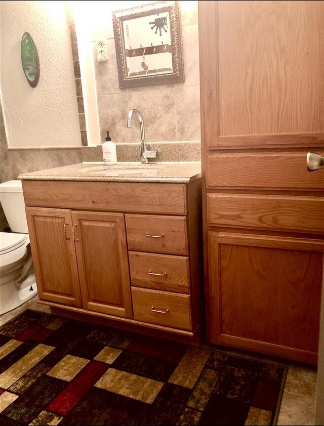 3600 Jeanetta St Unit 502, Houston, TX 77063 - half bathroom with toilet, vanity, and tile walls